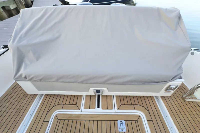 Slide: The Image of 2022 Tiara Yachts 34 LS with covered seating on teak deck. - 54
