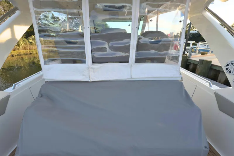 Slide: The Image of 2022 Tiara Yachts 34 LS boat interior with covered seating area. - 55