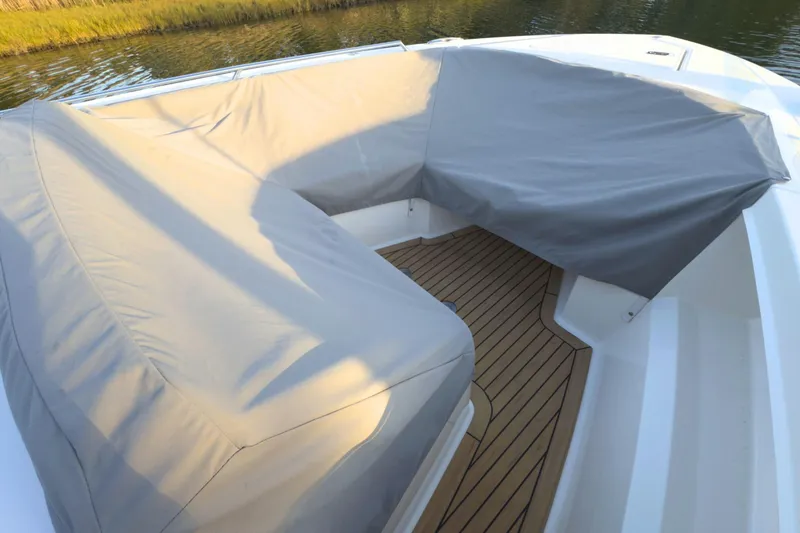 Slide: The Image of 2022 Tiara Yachts 34 LS with covered seating and teak deck. - 56