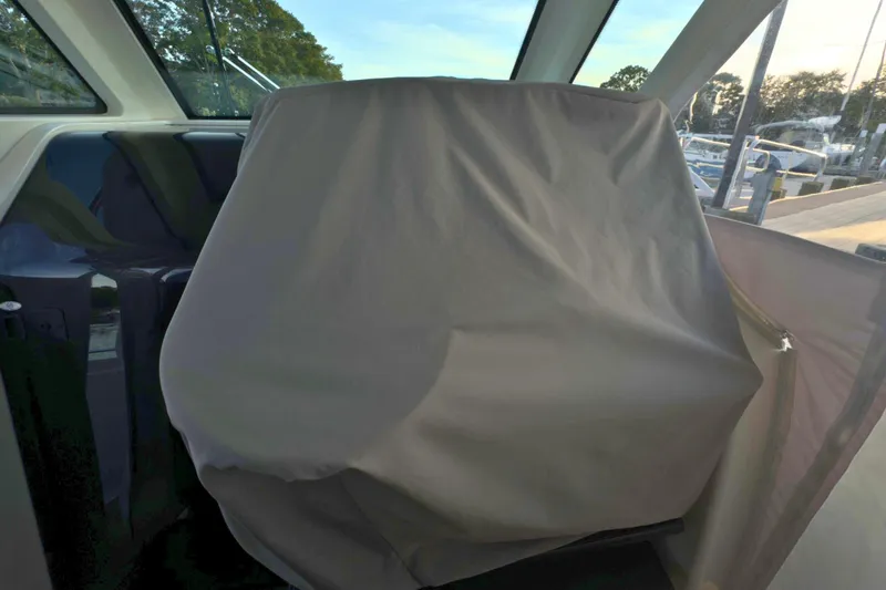 Slide: The Image of 2022 Tiara Yachts 34 LS interior with covered helm station. - 58