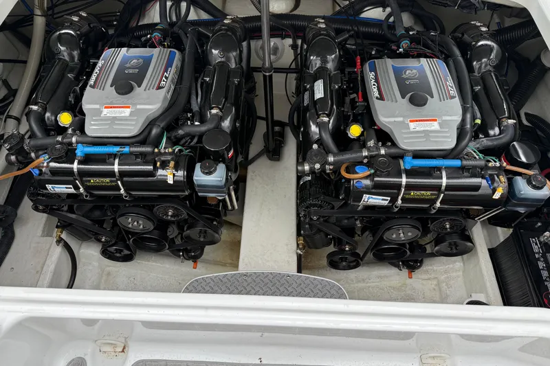 Slide: The Image of Twin engines in a 2010 Formula 290 Sun Sport boat, showcasing detailed mechanical components. - 10