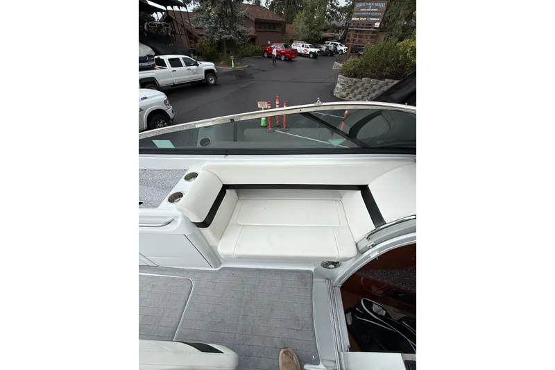 Slide: The Image of 2010 Formula 290 Sun Sport boat interior with white seating and cup holders. - 5