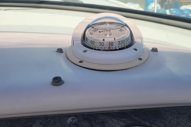 Slide: The Image of Compass on 1997 Sea Ray 330 Express Cruiser dashboard. - 19