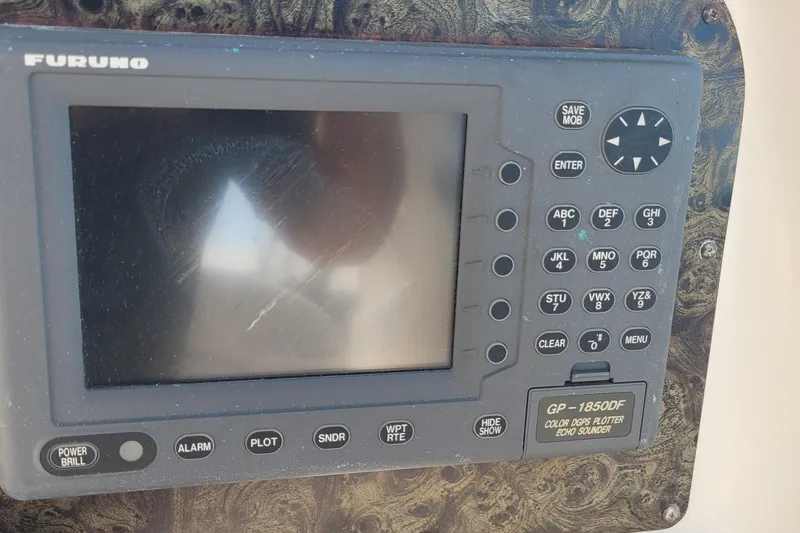 Slide: The Image of Furuno GP-1850DF GPS plotter on 1997 Sea Ray 330 Express Cruiser dashboard. - 22