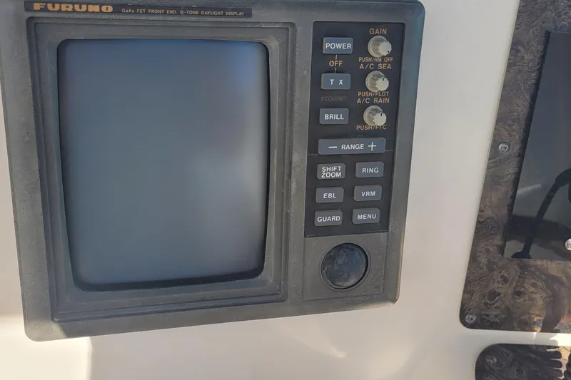 Slide: The Image of Furuno marine radar display on 1997 Sea Ray 330 Express Cruiser dashboard. - 23