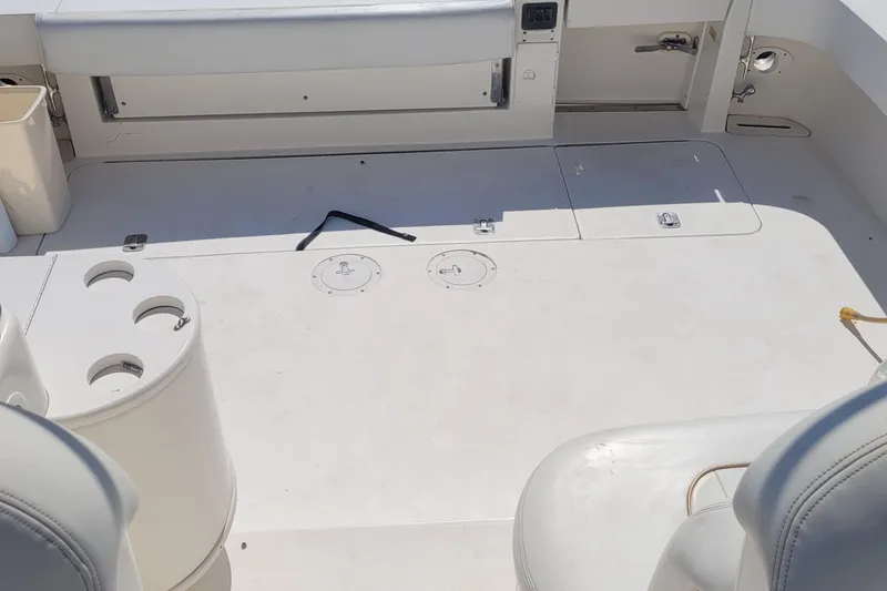 Slide: The Image of 1997 Sea Ray 330 Express Cruiser deck with seating and storage compartments. - 30