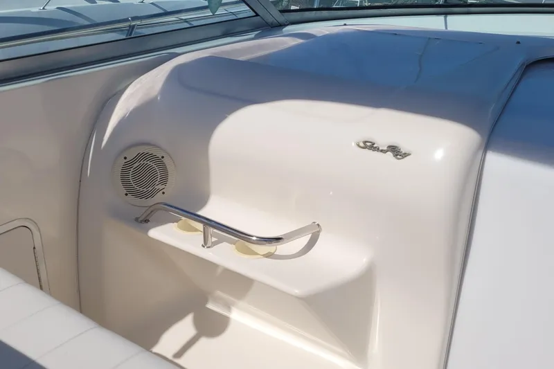 Slide: The Image of 1997 Sea Ray 330 Express Cruiser interior with speaker and cup holders. - 32