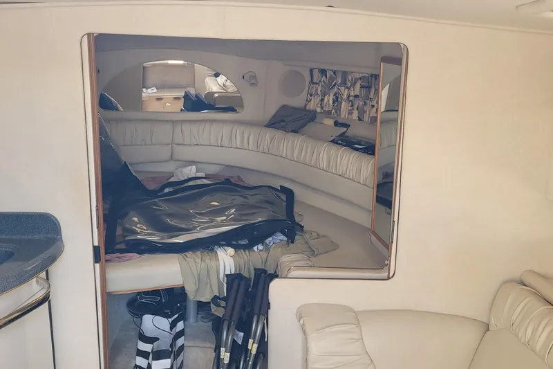 Slide: The Image of Interior of 1997 Sea Ray 330 Express Cruiser with seating and storage area. - 41