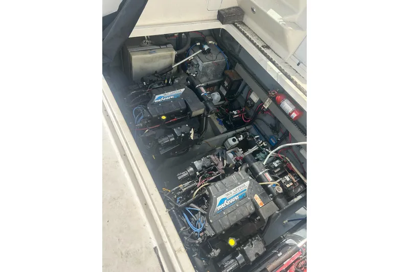 Slide: The Image of Engine compartment of a 1997 Sea Ray 330 Express Cruiser with MerCruiser engines. - 44