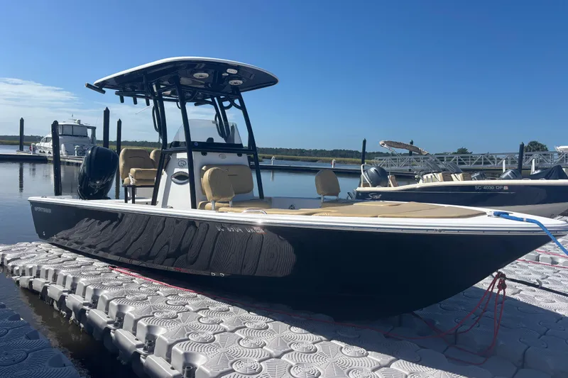 The Image of 2021 Sportsman Masters 247 Bay Boat docked on a sunny day. - 1