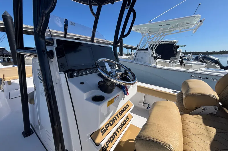 Slide: The Image of 2021 Sportsman Masters 247 Bay Boat interior with steering console and seating. - 15