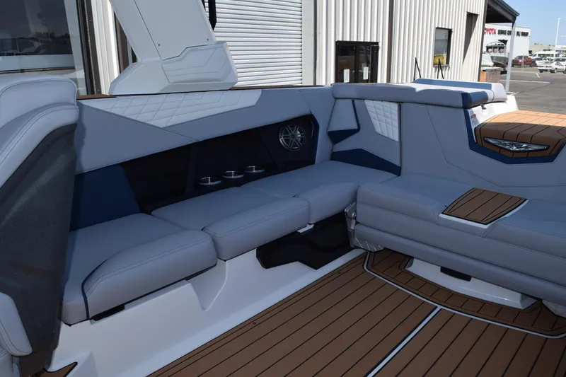Slide: The Image of 2025 Nautique Super Air Nautique S23 interior with luxurious seating and modern design. - 10