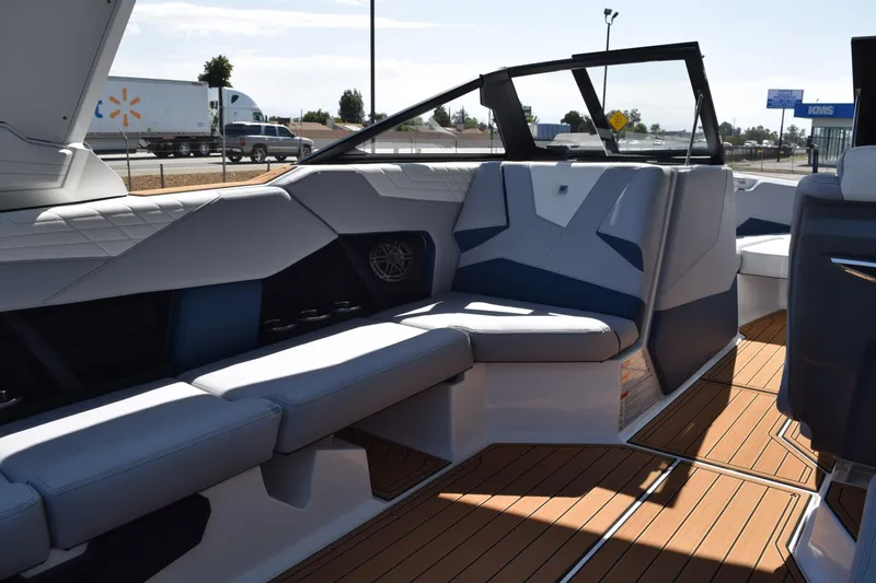 Slide: The Image of 2025 Nautique Super Air Nautique S23 interior with sleek seating and modern design. - 11