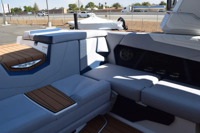 Slide: The Image of 2025 Nautique Super Air Nautique S23 interior with luxurious seating and modern design. - 13