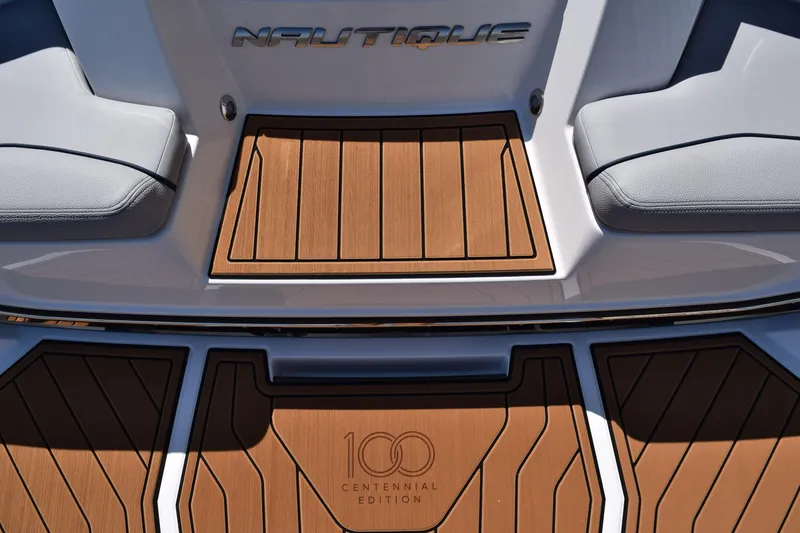 Slide: The Image of 2025 Nautique Super Air Nautique S23 boat deck, Centennial Edition, with teak flooring. - 15