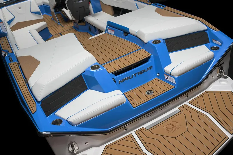 Slide: The Image of Manufacturer Provided Image: 2025 Nautique Super Air Nautique S23 boat interior with blue and white seating, teak flooring. - 27