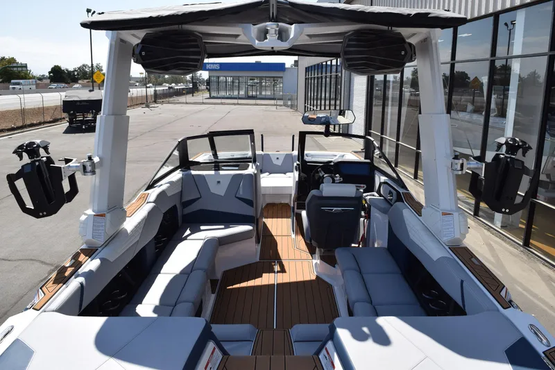 Slide: The Image of 2025 Nautique Super Air Nautique S23 boat interior with sleek seating and modern design. - 5