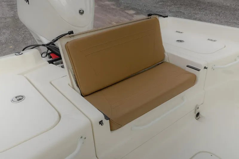 Slide: The Image of 2025 Skeeter SX2350 boat with tan cushioned seating and white deck. - 12