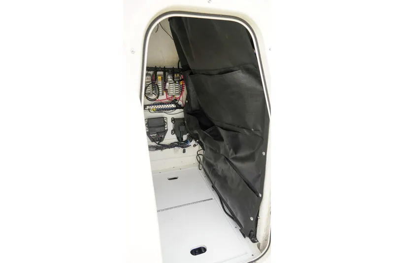 Slide: The Image of 2025 Skeeter SX2350 boat interior wiring and storage compartment. - 16
