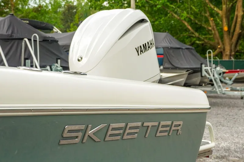 Slide: The Image of 2025 Skeeter SX2350 boat with Yamaha engine, parked outdoors. - 3
