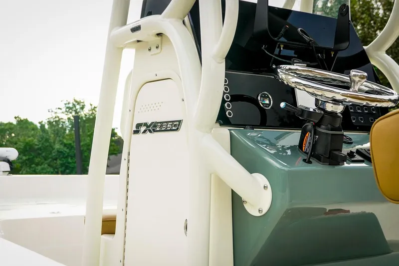 Slide: The Image of 2025 Skeeter SX2350 boat console with steering wheel and control panel. - 4
