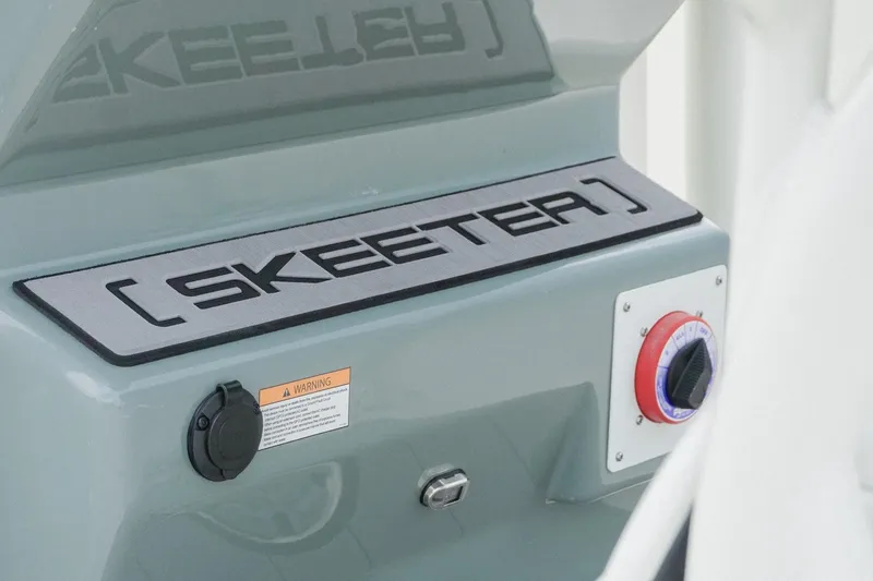 Slide: The Image of 2025 Skeeter SX2350 boat dashboard with logo and control panel. - 5