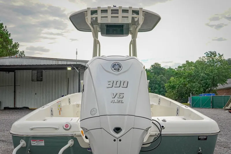 Slide: The Image of 2025 Skeeter SX2350 boat with Yamaha 300 V6 engine, parked outdoors. - 6