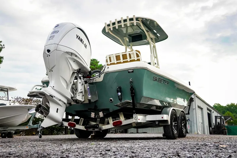 Slide: The Image of 2025 Skeeter SX2350 boat with Yamaha outboard motor on a trailer. - 7