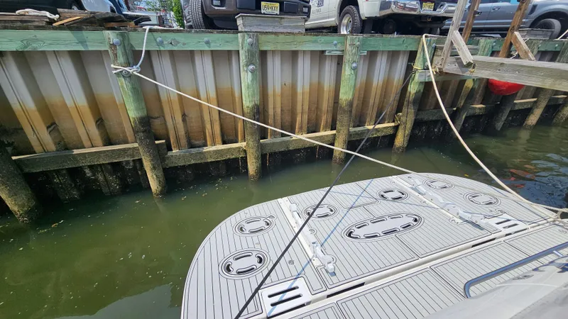 Slide: The Image of 1999 Sea Ray 500 Sundancer docked at a wooden pier. - 11