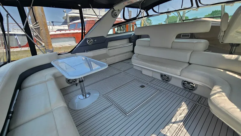 Slide: The Image of Luxurious interior of 1999 Sea Ray 500 Sundancer yacht with plush seating and sleek design. - 12