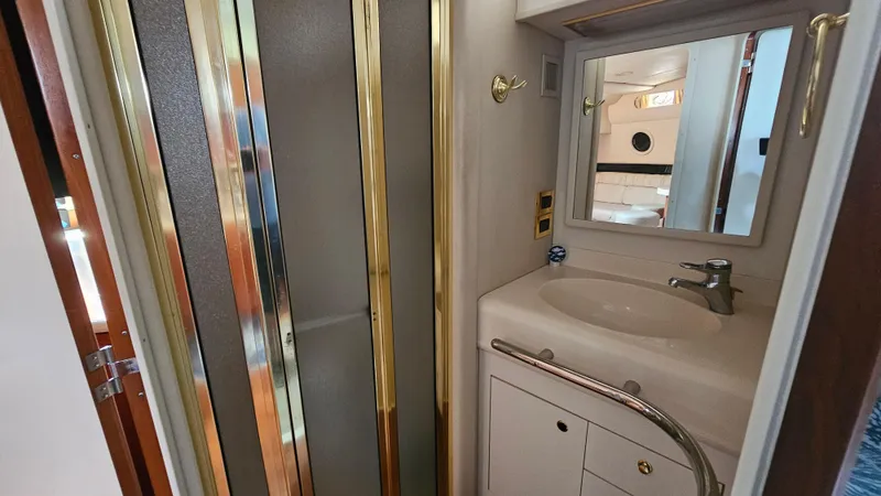 Slide: The Image of Bathroom interior of 1999 Sea Ray 500 Sundancer yacht with sink and shower. - 36