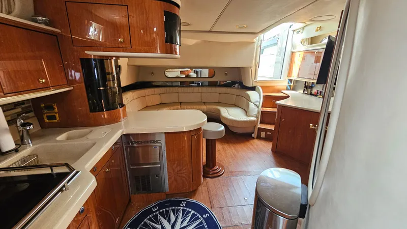 Slide: The Image of Luxurious interior of a 1999 Sea Ray 500 Sundancer yacht with elegant wood finishes. - 39