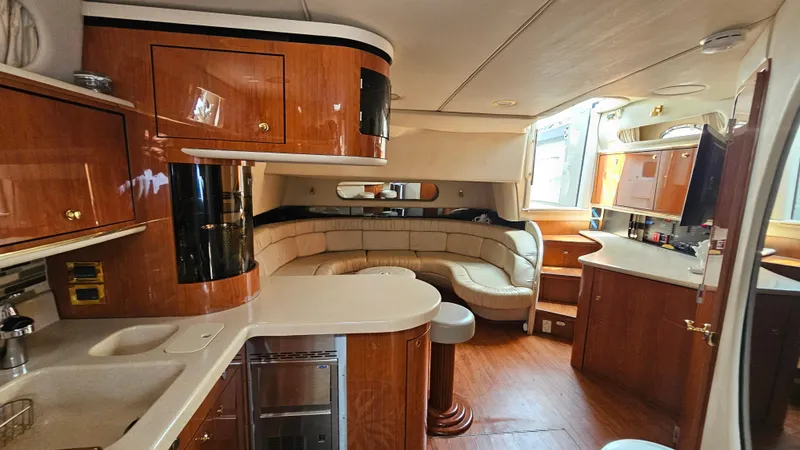 Slide: The Image of Luxurious interior of a 1999 Sea Ray 500 Sundancer yacht with elegant wood finishes. - 40