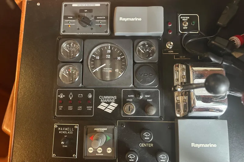 Slide: The Image of Control panel of a 2000 Island Gypsy 36 boat with Cummins Marine gauges. - 9