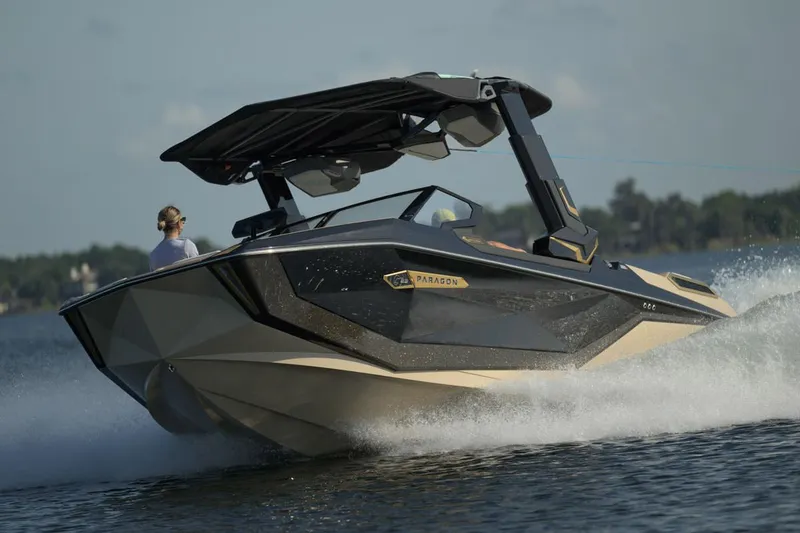 Slide: The Image of Manufacturer Provided Image: 2025 Nautique Super Air Nautique G23 Paragon speeding on water, showcasing sleek design and performance. - 22