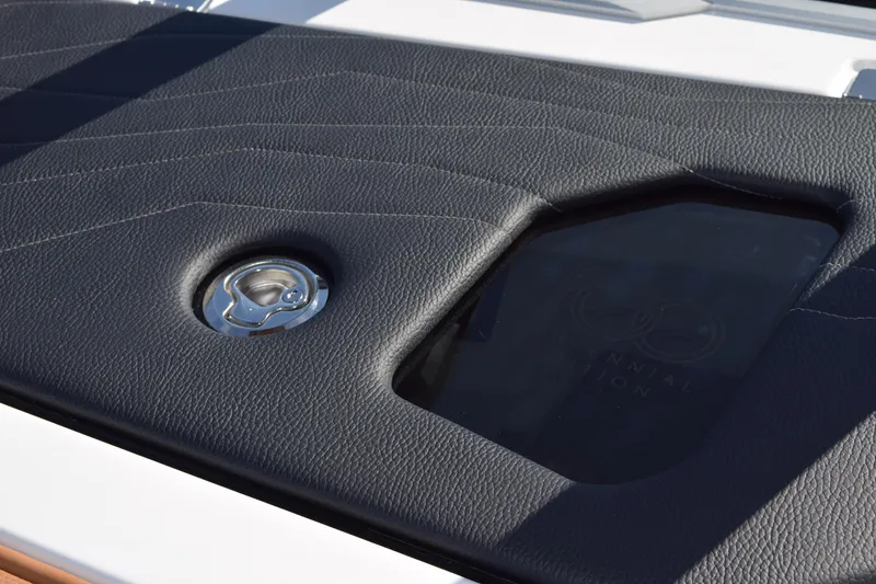 Slide: The Image of 2025 Nautique Super Air Nautique G23 Paragon, sleek black leather detail with chrome accent. - 5