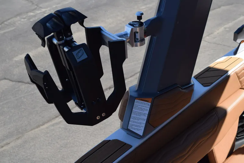 Slide: The Image of 2025 Nautique Super Air Nautique G23 Paragon boat detail, featuring a sleek wakeboard rack. - 18