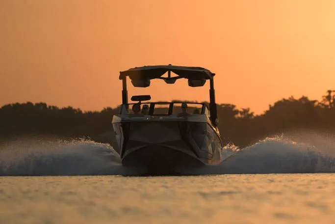Slide: The Image of Manufacturer Provided Image: 2025 Nautique Super Air Nautique G23 Paragon boat cruising at sunset. - 24
