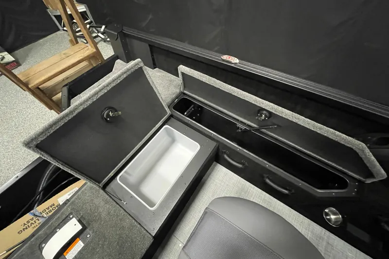 Slide: The Image of 2026 Alumacraft Competitor 175X Sport boat interior storage compartments. - 13