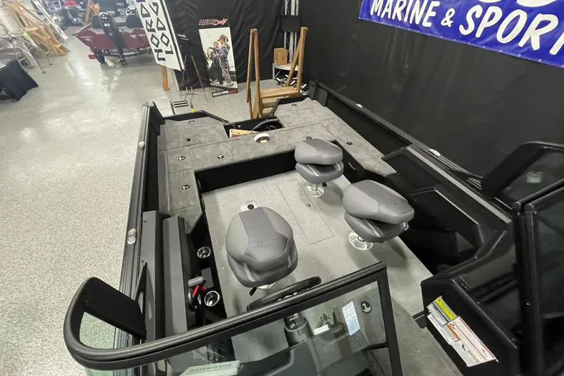 Slide: The Image of 2026 Alumacraft Competitor 175X Sport boat interior with seating and storage compartments. - 5