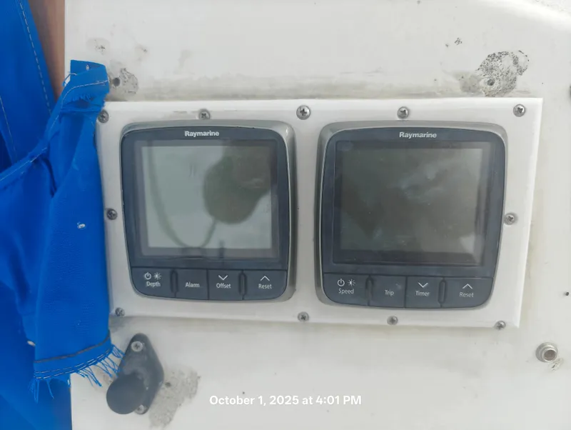 Slide: The Image of Raymarine displays on a 1990 Hunter 27-2 sailboat, showing depth and speed settings. - 10