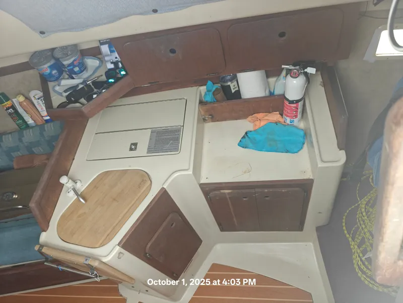 Slide: The Image of Interior of a 1990 Hunter 27-2 sailboat galley with sink and storage. - 15