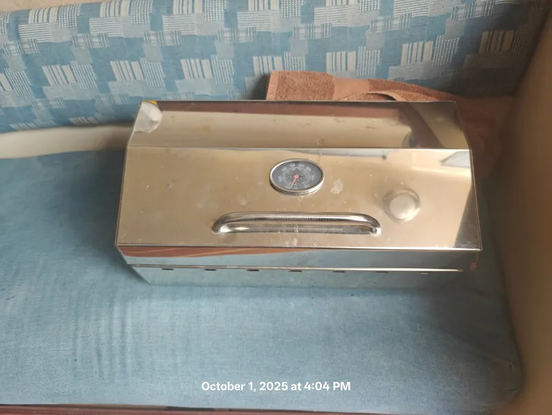 Slide: The Image of Stainless steel grill with thermometer on a Hunter 27-2 boat, dated October 1, 2025. - 17