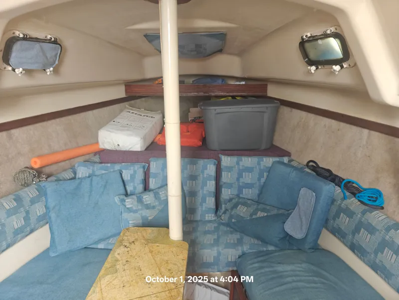 Slide: The Image of Cozy interior of 1990 Hunter 27-2 sailboat with cushions and storage. - 18