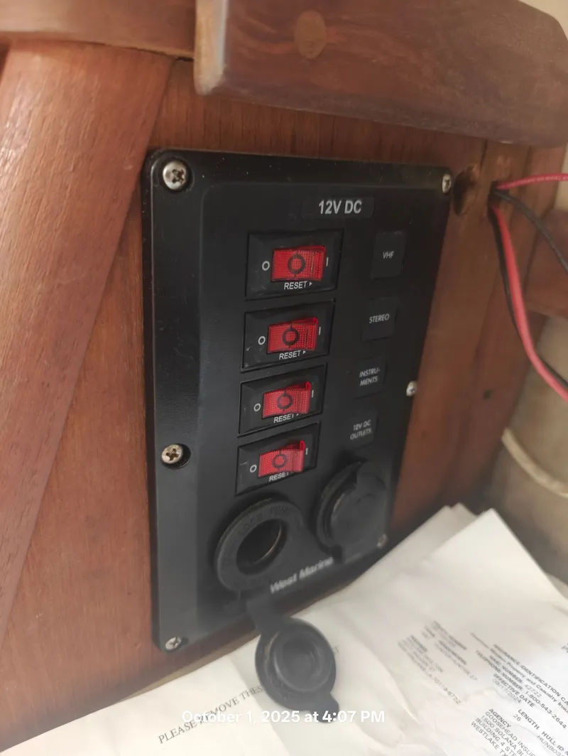 Slide: The Image of Control panel of a 1990 Hunter 27-2 sailboat with 12V DC switches. - 28