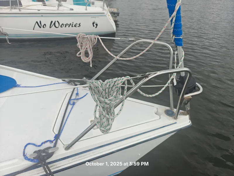 Slide: The Image of Hunter 27-2 sailboat bow with ropes, docked near another boat, October 2025. - 4