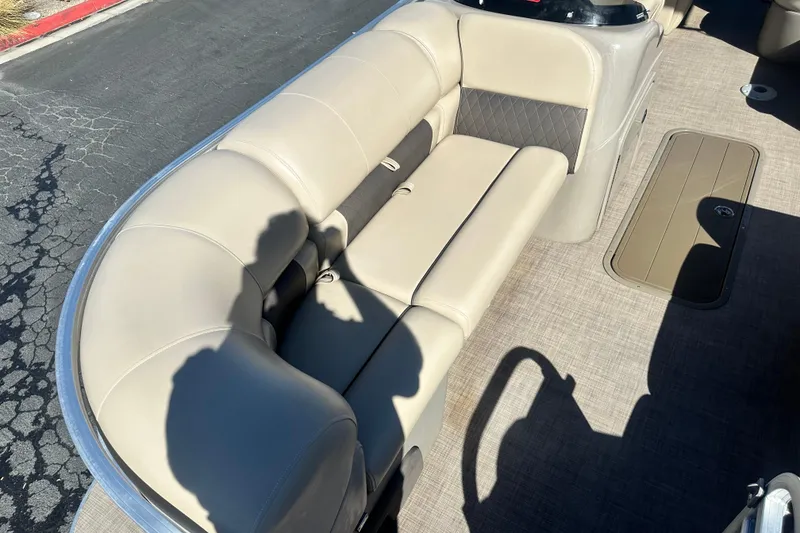 Slide: The Image of 2023 Sun Tracker Party Barge 22 RF XP3 with beige seating and spacious layout. - 11