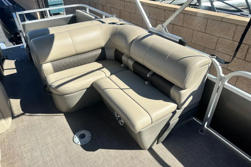 Slide: The Image of 2023 Sun Tracker Party Barge 22 RF XP3 interior seating, featuring plush gray upholstery. - 14