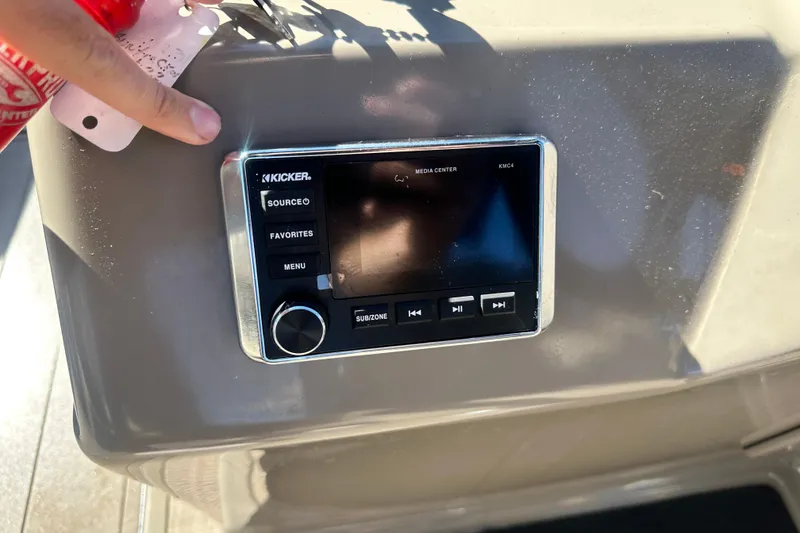 Slide: The Image of 2023 Sun Tracker Party Barge 22 RF XP3 boat interior with steering console and seating. - 17