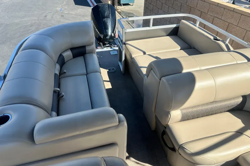 Slide: The Image of 2023 Sun Tracker Party Barge 22 RF XP3 dashboard with steering wheel and controls. - 18